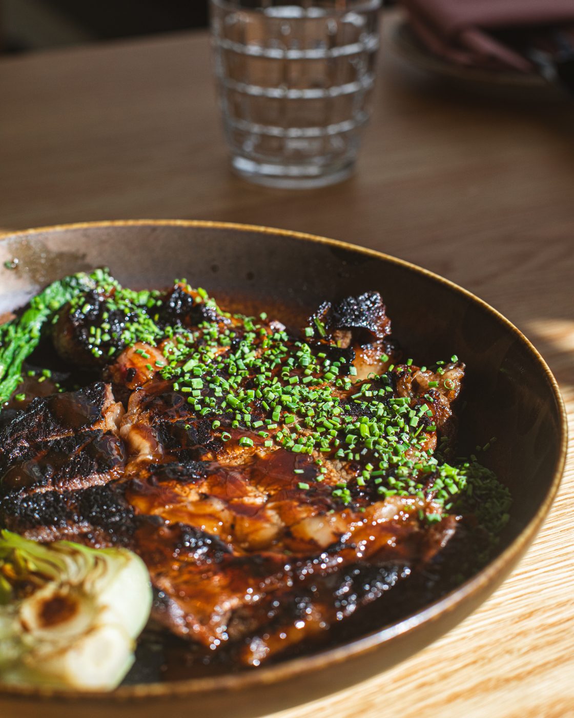 Glazed ribs with scallions and charred citrus