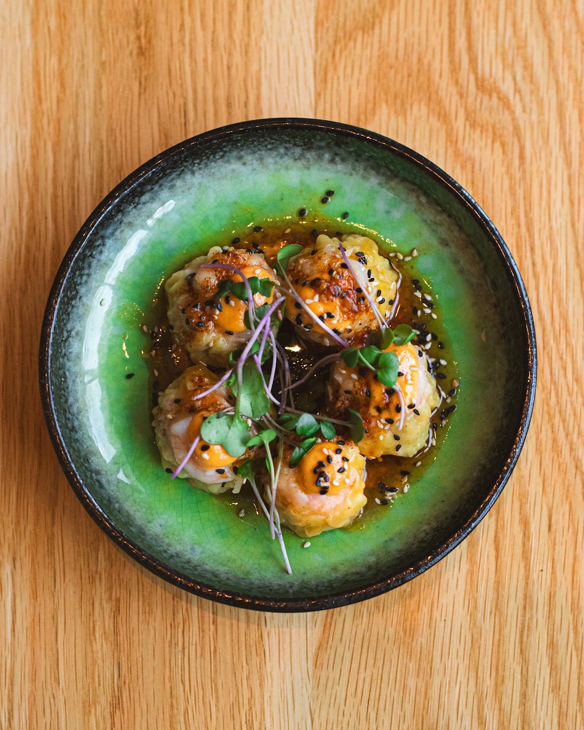 Seared scallops plated for an intimate supper club